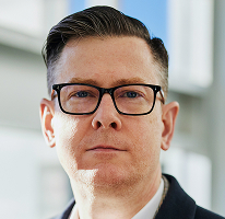 Alexander Hughes, CEO et dirigeant d’une société de trading de cryptomonnaie, en portrait